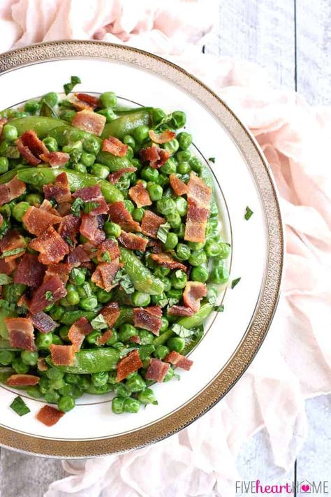 The ultimate Easter side dish, Creamed Peas with Bacon   Mint feature a delicious combo of flavors and textures from sweet green peas, fresh sugar snaps, salty bacon, a decadent cream sauce, and refreshing pops of mint! Peas With Bacon, Easter Side Dish, Easter Dinner Menus, Recipe Menu, Vegetable Cooking, Veggie Fried Rice, Creamed Peas, Easter Side Dishes, Spring Peas