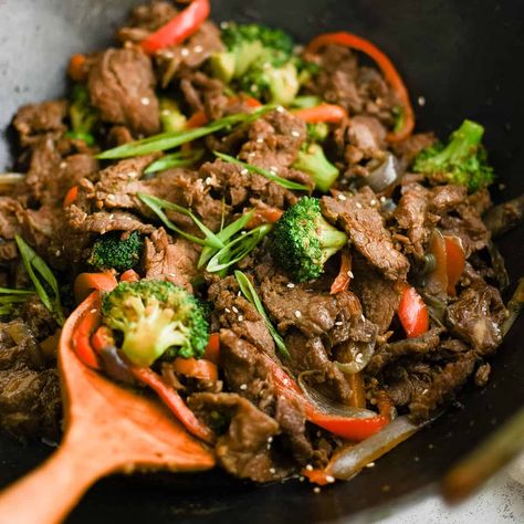 Sesame Garlic Beef Stir Fry is better than takeout and simple to make right at home! Easy to throw together with tender steak strips and fresh veggies, this dinner comes together in about half an hour. Ginger Beef And Green Bean Stir Fry Real Simple, Tender Beef And Broccoli Stir Fry, Sesame Basil Beef Stir Fry, Cumin Beef Stir Fry, Homemade Egg Drop Soup, Trader Joe’s Sesame Teriyaki Beef Skirt Steak, Green Chili Pork, Garlic Beef, Slow Cooker Casserole