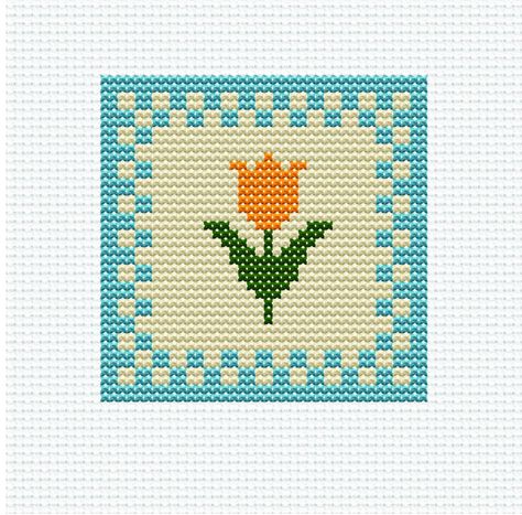 Tulip, Cross Stitch Pattern Get ready to bring a touch of farmhouse charm to your home with our Tulip Cross Stitch Pattern. This simple and elegant design is perfect for beginners looking to try their hand at needlepoint. Add a personal touch to your DIY decorations or create a thoughtful gift for a loved one. Our cross-stitch pattern chart is perfect for: -Stitchers who want to spend time at home being creative and busy -Crafters who are looking for a new project -Hobbyists who want to try some Simple Cross Stitch Flower, Granny Square Cross Stitch, Cross Stitch Flowers Simple, Color Block Cross Stitch, Easy Flower Cross Stitch Pattern, Simple Cross Stitch Patterns Free, Simple Flower Cross Stitch Pattern, Western Cross Stitch, Tiny Cross Stitch Patterns