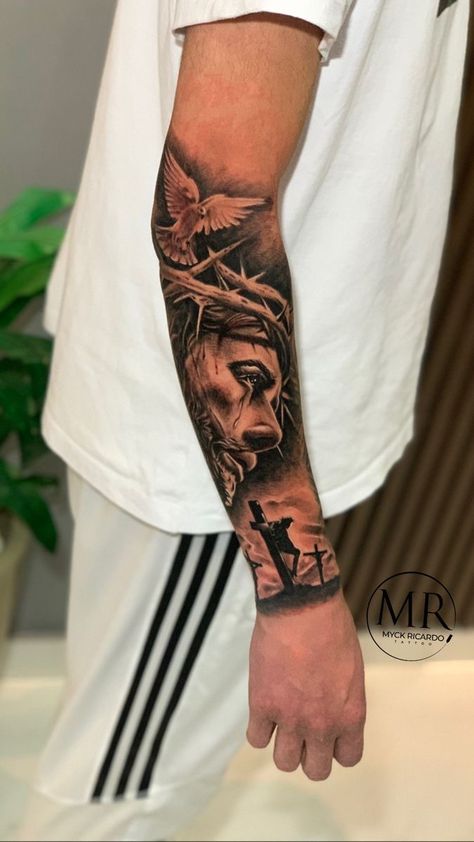 Jesus Arm Tattoo Sleeve, Mens Sleeve Tattoo Ideas Top 10, Forearm Men Tattoos, Cross Forearm Tattoo Men, Men Sleeve Tattoo Ideas Unique, Cool Forearm Tattoos Men, Biblical Tattoos For Men Forearm, Jesus Sleeve Tattoo, Tattoo Sleeve Men Arm