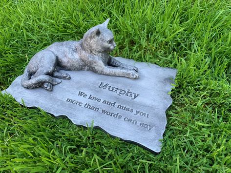 Material:  White cement. Water proofed. Good for exterior  Size :        11.5'' length x 7 width x 3.77 height Full cast Rotary engrave , not laser so life time durability. Preserve the legacy of your cherished feline friend with a personalized cat memorial stone. This touching cat memorial plaque is a heartfelt way to honor their memory. Whether placed as a cat memorial stake in your garden or displayed indoors, this pet memorial stone is a lasting symbol of your enduring bond. As a cat memorial gift, it offers comfort and solace during times of pet loss, a thoughtful pet sympathy gift that conveys empathy. This cat headstone serves as a dignified cat grave marker, ensuring your beloved companion's remembrance lives on. Cat Grave Ideas, Pet Memorial Ideas Cat, Kitty Memorial, Diy Gravestone For Pets, Cat Headstone, Cat In Cemetery, Cat Memorial Garden, Black Cat Memorial, Cat Grave Marker