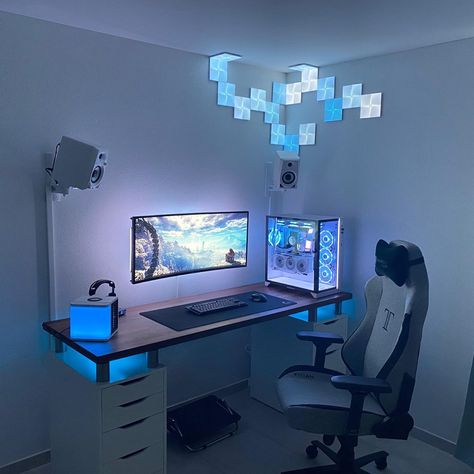 Is this arctic theme 👍 or 👎? comment below [via reddit user/AJ989] ⁣ This gaming setup looks and feels different from the rest. I like the soothing blue and white theme and its lighting. Off the bat, he is using the popular Ikea Alex drawers, Karlby tabletop, and custom supports. The LED strips behind the LG UltraGear 38GN950 monitor gives off a great glow which helps to make it pop. The design of the Nanoleaf canvas on the wall is unique and give you a growth/spreading like illusion. ⁣ Gaming Gaming Computer Room, Room Setup Ideas, Gamer Bedroom, Gaming Setup Ideas, Setup Inspiration, Gaming Desk Setup, Gaming Room Ideas, Gaming Rooms, Gamer Setup