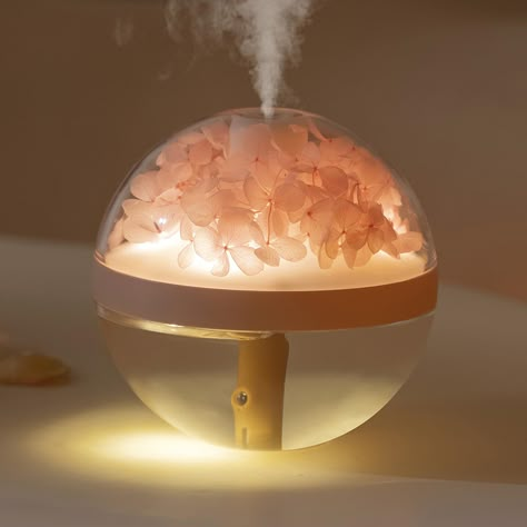 PRICES MAY VARY. PRESERVED FLOWER INSIDE & WARM NIGHT LIGHT - This awesome humidifier comes with a preserved flower ball night light feature that creates a relaxing atmosphere while emitting a soothing mist. It offers maximum relaxation for you, and the night light can help improve your sleep quality. PORTABLE MINI HUMIDIFIER & RECHARGEABLE BATTERY POWER SUPPLY - The compact and portable design makes it easy to take this humidifier anywhere. It is powered by a rechargeable battery, making it per Air Diffuser The Fragrance Room, Eternal Flower, Aromatherapy Humidifier, Portable Humidifier, Cool Mist Humidifier, Pink Hydrangea, Air Humidifier, White Lamp, Aroma Diffuser