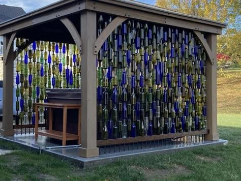 Walls made of wine bottles in O'Fallon, Mo., and 6 other great ideas for reuse | Home & Garden | stltoday.com Wine Bottle Fence, Bottle Fence, Wine Bottle Trees, Wine Bottle Garden, Wine Bottle Wall, Hot Tub Gazebo, Bottle Trees, Bottle Tree, Wine Bottle Art