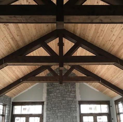 Truss ceiling in progress! That's a cedar ceiling and wrapped trusses that have been stained with Minwax 211 Provincial. Awesome! Black Trusses Ceilings, Interior Trusses Beams, Great Room With Trusses, Scissor Truss Ceiling Beams, Roof Truss Design Exposed Beams, 6/12 Vaulted Ceiling, Faux Trusses Vaulted Ceilings, Wood Truss Ceiling, Exposed Truss Ceiling