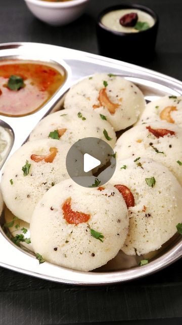 Aarti Madan on Instagram: "Instant Rawa Idli. I love this recipe and make it often for my breakfast. Do give it a try ❤️

Ingredients

2 tablespoons oil
1 teaspoon mustard seeds/ rai
1 teaspoon urad dal
1 teaspoon roasted chana dal
1 teaspoon ginger, finely chopped
1 teaspoon green chillies, finely chopped
1 cup (170g) semolina/suji/rawa
1 tablespoon fresh coriander, finely chopped
1 cup (240g) curd/dahi
¾ cup water (approximately)
1 eno (fruit salt) sachet or ½ teaspoon baking soda
salt to taste
8-10 roasted cashews

Steps In Making Instant Rawa Idli

1. Heat oil in a kadai. Now add mustard seeds, urad dal and roasted chana dal and cook for a few seconds or till the dal gets a light golden brown colour.

2. Now add finely chopped ginger and green chillies and cook for another 10 seconds. Suji Idli Recipe, Idli Sambhar, Rawa Idli Recipe, Urad Dal Recipes, Idli Recipe, Light Golden Brown, Dosa Recipe, Roasted Cashews, Mustard Seed