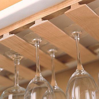 Watch this video to find out how to make an inexpensive rack to store and display wine glasses beneath the hanging cabinets in your kitchen, using standard T-molding available at home centers. Diy Wine Glass Rack, Beam Kitchen, Wine Glass Shelf, Wine Glass Storage, Hanging Cabinet, Home Bar Designs, Wine Glass Rack, Hanging Rack, Rack Kitchen