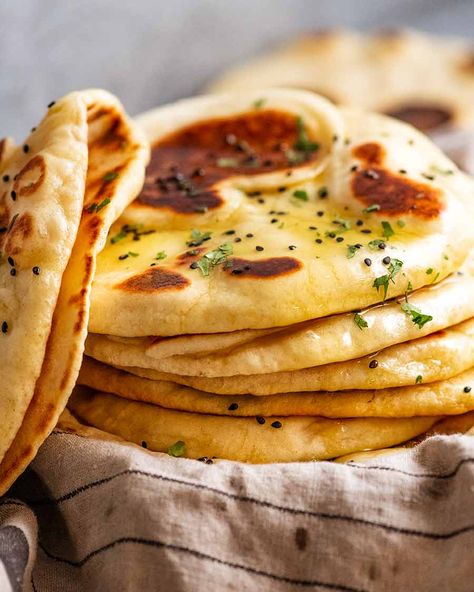 Naan | Recipe Tin Eats ~ Easy recipe for this iconic Indian flat bread; uses instant yeast, either butter or ghee (link given to make ghee), & the dough doesn't require kneading. Fluffy with a chewy, restaurant quality. Brush with garlic-infused ghee or melted butter. Can sprinkle with chopped cilantro & optional nigella seeds. Pizza Naan, Make Naan Bread, Easy Naan, Pane Naan, Naan Bread Recipe, Vegan Naan, Homemade Naan Bread, Pita Bread Recipe, Recipes With Naan Bread