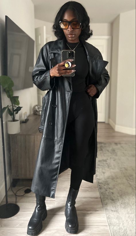 Black leather trench coat for fall 2023 monochromatic outfit Trench Coat Costume Halloween, Faux Leather Coat Outfit, Black Leather Outfit Black Women, Faux Leather Trench Coat Outfit, Black Faux Leather Trench Coat Outfit, Leather Trench Outfit, Trench Coat Outfit Black Women, Leather Trench Coat Outfit Aesthetic, Leather Trench Coat Outfit