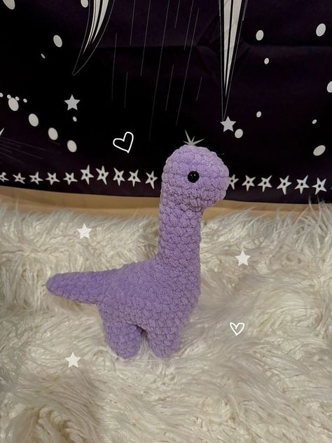 Crochet Purple Dinosaur Plushie Crochet toys free patterns easy #crochettoysfreepatternseasy #crochet #crochettoy #crochetpattern #crochetpatterns 4.321 Crochet Ideas With Purple Yarn, Cute Purple Crochet Ideas, Crochet Purple Amigurumi, Crochet With Purple Yarn, Things To Crochet With Purple Yarn, Purple Things To Crochet, Purple Crochet Ideas, Purple Crochet Projects, Purple Amigurumi