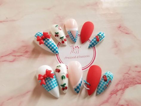 Blue and white gingham cherry nails with red matte accents. Choose your shape/length. Custom sizes should be left in the personalization section.  Each set will come with 12 nails, so there are 2 replacement nails just in case you lose one or two. Each set is handmade to order. Because of this, there will be differences in each set. Lighting or different monitors may change the look of color in the photos slightly. *All sets come in a gift box with an alcohol prep pad, cuticle stick, buffer, nail file, and glue. -Once shipped, I am not responsible for lost, delayed, or damaged packages. -I will not be held responsible for wrong sizes. If you are unsure of your sizes, you can purchase a sizing kit in the shape of your choice for a perfect fit. I will always do my best to ensure the sizes ar Red And Blue Cherry Nails, Red Gingham Nails, Picnic Nail Art, Red Blue Nails, Americana Nails, Gingham Nails, Nails With Red, Set Lighting, Future Nails