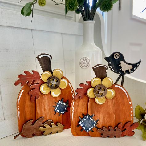 Cute and fun set of chunky pumpkins that stand on their own when laser cut from 1/4 wood. This fun and whimsical set includes 2 pumpkins decorated with faux buttons and patches to give a unique look. The project is scored for easy placement of pieces and is great for all ages. Pumpkins can be made larger. Each one as shown measures around 9" tall. Make sure to check out our coordinating fall designs by searching Easely Created in the designer search section. Make sure to check out our other Ease Small Wooden Pumpkins, Pumpkin Shaped Signs Wooden, Thanksgiving Wood Decor, Fall Crafts To Sell 2024, Wooden Fall Crafts, Fall Crafts To Sell, Fall Wooden Decor, Wooden Pumpkin Crafts, Wood Pumpkins Diy