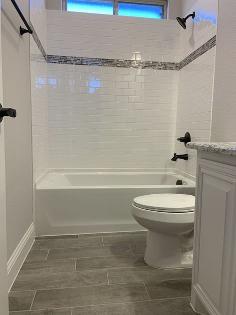 Hall Bath With Tub, Bathroom Remodel With Subway Tile, Small Bathrooms With Tubs Ideas, Bathroom Shower Remodel Ideas Tile, Tile By Bathroom Sink, Subway Tile With Bathtub, Dark Tile Bathroom Floor White Walls, Bathroom Bathtub Tile Ideas, Shower Wall Tile Ideas With Tub