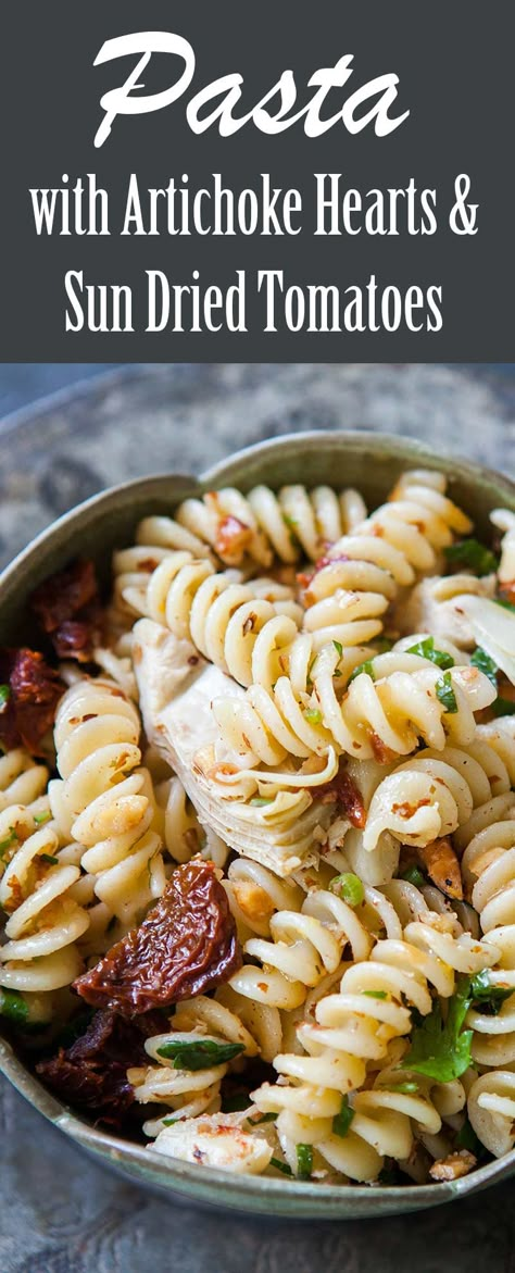 Fusilli pasta tossed with marinated artichoke hearts, sun-dried tomatoes, and toasted almonds. Easy VEGAN pasta dish, perfect for a potluck! Pasta With Artichoke Hearts, Artichoke Heart Recipes, Easy Vegan Pasta, Marinated Artichoke Hearts, Salad Appetizer Cups, Almonds Recipe, Vegan Pasta Dish, Pasta Casserole Recipes, Artichoke Pasta