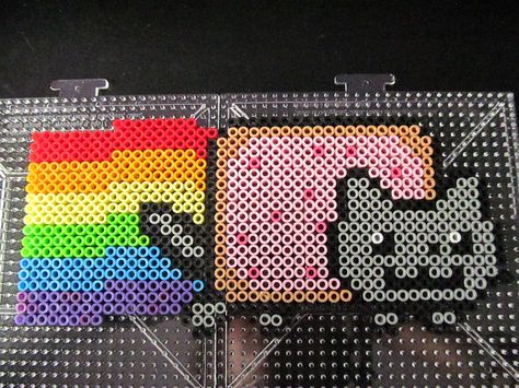 Nyan Cat Perler Bead by ~KittyEspeon on deviantART} Thanks, all the people who pinned this! ^_^ I am so happy! ~Kitty Easy Perler Bead Patterns, Pixel Beads, Melty Bead Patterns, Pearl Beads Pattern, Easy Perler Beads Ideas, Beads Pattern, Fuse Bead Patterns, Perler Bead Templates, Diy Perler Bead Crafts