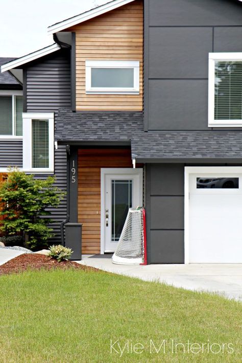 Exterior home in vinyl siding iron ore with hardi panels and cedar shiplap style panelling. Kylie M INteriors edecor and online decorating and color services Iron Ore Exterior With Cedar, Acrylic Stucco Exterior, Siding Panels Exterior, Cement Siding Exterior, Board And Batten Siding Colors, Cedar Shiplap, Modern Siding, Casa Retro, Exterior Home Design