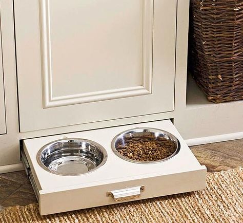 dog bowl storage - the toe kick!  Genius!   And better yet, the cabinet door is actually the door to a built in dog crate!  Ventilation holes are at the top. Dog Bowl, Dog Bowls, Bowl