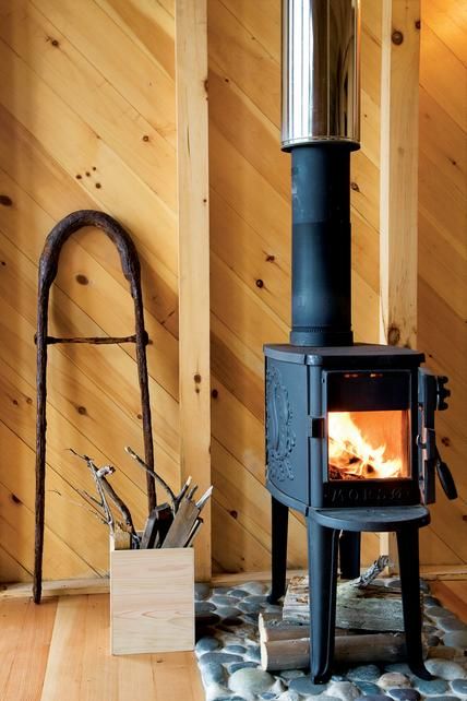 Here's a traditional Scandinavian-inspired look: the tiny Classic Forest Stove from Morso, which is based on a design from the 1930s, but incorporates the very latest in combustion technology for greatly reduced smoke emissions. At 28 inches high, 13 inches wide, and 28 inches deep, this stove is a good small-space choice; $1,700. Contact Morso to locate a dealer. Morso Wood Stove, Small Wood Burning Stove, Tiny Wood Stove, Mini Loft, Wood Stove Fireplace, Tiny Cabins, Casa Container, Tiny Cabin, Stove Fireplace