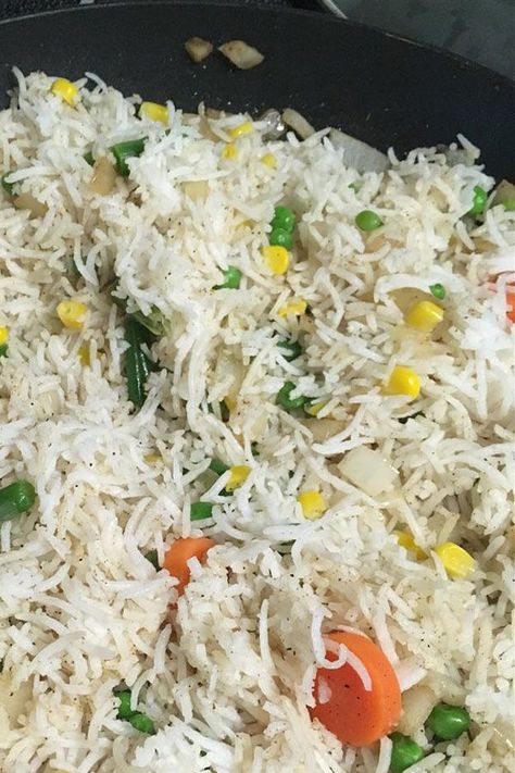 Looking for the best vegetable rice recipe? Try cooking this Indian vegetable rice. Use basmati rice, frozen mixed vegetables, and garam masala to cook the best rice side dish recipe. Vegetable Rice Recipes, Vegetable Rice Recipe, Vegetable Pulao Recipe, Mixed Veggies, Egg Fried Rice, Spiced Rice, Rice Side, Indian Rice, Vegetable Fried Rice