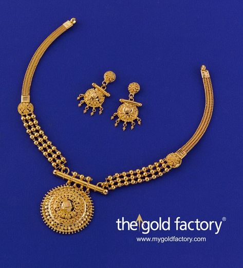 A three-step pasha pendant on a pipe hanger supported by triple ball chains that morph into a plain heley chain after the flower sidepiece on each side, that's how carefully detailed this lovely lightweight necklace is. Distinctly Gold Factory in its design ethic, it comes with a pair of matching mini earrings, all handcrafted in hallmarked 22K gold. Pipe Hanger, Gold Jewellery India, Gold Factory, Bridal Diamond Necklace, Temple Jewelry Necklace, Neck Pieces Jewelry, Bridal Jewelry Vintage, Small Necklace, Gold Pendant Jewelry