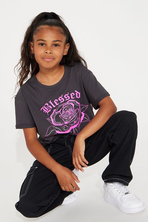 Available In Charcoal. Rolled Short Sleeves Crew Neck Front Screen Print Rhinestones 100% Cotton Model Wears A Size M XS: (4/5), S: (6/6X), M: (7/8), L: (10/12), XL: (14/16) Imported | Mini Blessed & Blossomed Tee Shirt in Charcoal size Small by Fashion Nova Cropped Boxy Fit T-shirt With Graphic Print, Boxy Fit Graphic Print Cropped T-shirt, Boxy Fit Cotton Graphic Cropped T-shirt, Black Stretch Graphic Cropped T-shirt, Tv Clothes, Fashion Nova Shirts & Tops, 5 S, Jeans Jumpsuit, Matching Dresses