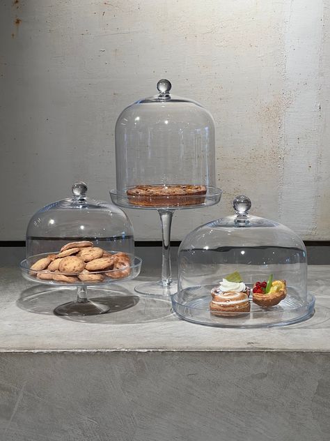 Cake holders are practical and stylish accessories designed to protect, display, and transport cakes. Typically made from materials like plastic, glass, or metal, they come in various shapes and sizes to accommodate different types of cakes. Many cake holders feature a dome-shaped lid to keep the cake fresh and safe from contaminants, while others include a sturdy base for easy handling. Perfect for birthdays, parties, or any special occasion, cake holders not only preserve the cake’s appearance