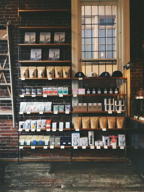 Bag Shelf Ideas, Shelves On Wall, Rustic Coffee Shop, Clever Dripper, Coffee Display, Vancouver Photos, Cafe Display, Coffee Market, Small Coffee Shop