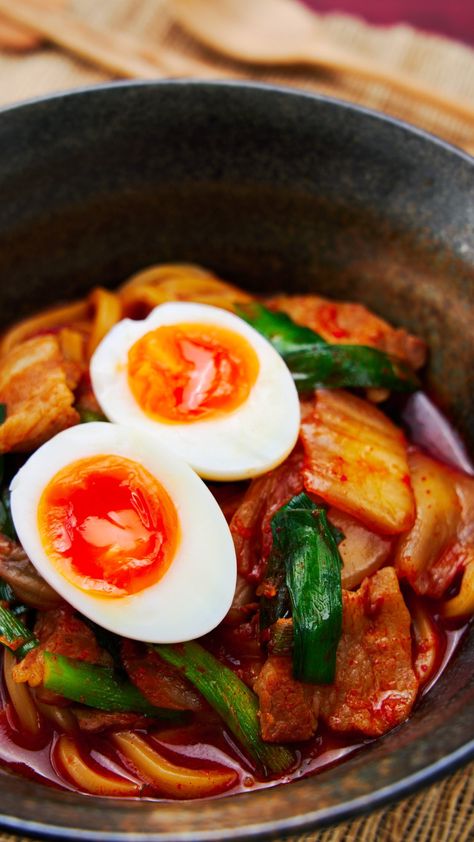 Thick chewy udon noodles in a spicy pork and kimchi broth topped with a soft boiled egg with a molten yolk. Spicy Udon Noodle Recipe, Spicy Udon Noodles, Kimchi Udon, Pork Udon, Asian Potluck, Kim Chee, Easy Kimchi, Kimchi Noodles, Homemade Kimchi