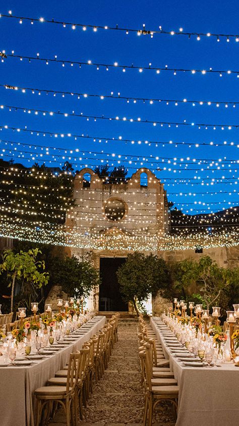 Festoon Lights over Wedding Table Boho Destination Wedding, Mamma Mia Wedding, Candle Lit Dinner, Festoon Lights, Courtyard Wedding, Dream Wedding Reception, Destination Wedding Italy, Mediterranean Wedding, Wedding Spain