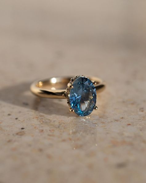 If you’re wondering what that gorgeous centre stone is, it’s a 2ct, oval blue spinel 💙 For even further flare, we have a stunning curved hidden moissanite halo Details: - 2ct oval blue spinel - 20x round moissanites - 10k yellow gold - 2.3mm wide shank #engagementringdesign #customengagementring #spinelengagementring #nz #ovalengagementring #aus #engagementringideas Spinel Engagement Rings, Boda Ideas, Happy Bride, Blue Engagement Ring, Blue Spinel, Future Engagement Rings, Classic Engagement, Blue Stone Ring, Classic Engagement Rings