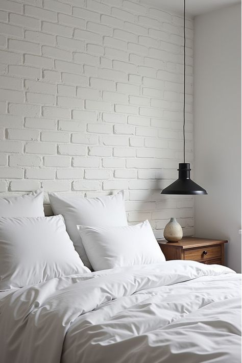 Scandinavian-style bedroom featuring white brick wall and black pendant Brick Accent Wall Bedroom, Clay Brick Wall, White Brick Wall Bedroom, White Brick Accent Wall, Unique Accent Wall Ideas, Bedroom Accent Wall Ideas, Brick Wall Bedroom, Unique Accent Wall, Brick Accent Walls