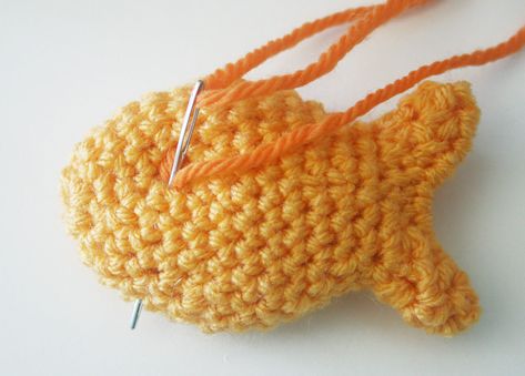 Free Crochet Pattern: Goldfish Cracker Pin! | Twinkie Chan Blog Goldfish Cracker Crochet Pattern, Crochet Goldfish Cracker Pattern Free, Crochet Goldfish Cracker Pillow Pattern Free, Crochet Goldfish Cracker, Gold Fish Crochet Pattern Free, Crocheted Fish Patterns Free, Goldfish Crochet Pattern Free, Mini Crochet Patterns, Crochet Goldfish