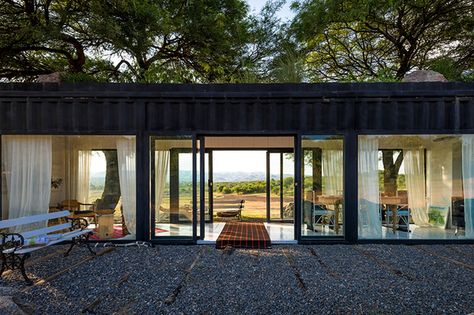 With wood-plank floors and ceiling, wispy curtains, and vintage furniture, the whole space is going for a rustic-chic vibe. Architecture Digest, Creek House, Wood Plank Flooring, Casa Container, Bay House, Timber Cladding, Shed Homes, Container Homes, Shipping Containers