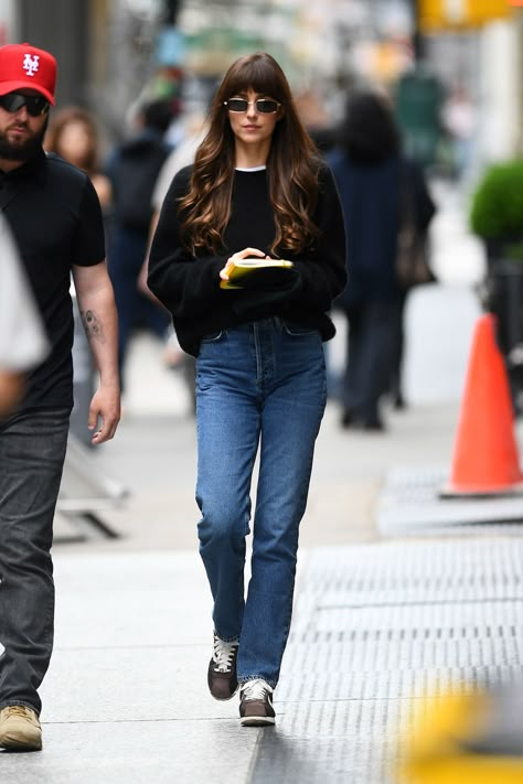 Dakota Johnson Wore the Sneaker Trend That's Coming for Sambas | Who What Wear UK Celeb Winter Street Style, Dakota Johnson Sneakers, Dakota Johnson Am I Ok, How To Style Black Sneakers, Dakota Johnson Winter, Nike Cortez Outfit, Celebrity Street Style Casual, Dakota Johnson Street Style, Black Sweater Outfit