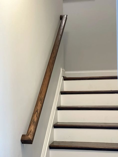 Basement railing stained using a dark stain to match the stairs. Painting Handrails For Stairs, Stain Stair Railing, Dark Stained Stairs, Stain And Seal Wood, Basement Railing, How To Restain Wood, Redo Stairs, Wood Staining, Floor Options