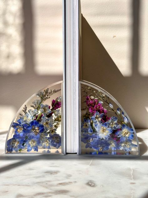 Celebrate the beauty of nature with our unique resin flower bookends. Perfect as a gift or a treat for yourself, these bookends can be customized with your own flowers or purchased from our pre-made collection. A beautiful way to keep your memories alive. Flower Gifts, Resin Flowers, Real Flowers, Flower Gift, Great Places, Timeless Beauty, Bookends, Magnolia, The Beauty