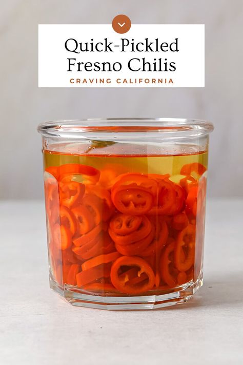 A jar of sliced, pickled fresno chilis. Pickled Fresno Peppers, Pickled Fresno Chiles, Pickled Chili Peppers, Serano Chilis, Fresno Peppers Recipes, Fresno Chili Peppers Recipes, Fresno Chili Peppers, Craving California, Cryptid Club