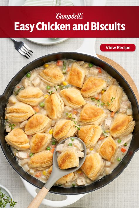 This Easy Chicken & Biscuits recipe only takes 5 minutes to prep, making it perfect for Easter, and it's also a great way to use up leftover chicken or turkey! Easy Chicken & Biscuits is like pot pie in a skillet! While the oven is heating, quickly simmer chicken and vegetables in Condensed Cream of Potato Soup- the soup makes a rich and creamy sauce that brings the filling together. Then, right in the skillet, just top the filling with refrigerated biscuits bake until golden brown. One Skillet Chicken Pot Pie, Meals With Chicken Stock, Sympathy Food Meals, Easy Chicken Biscuit Casserole, Chicken Pot Pie With Grands Biscuits, Chick Pot Pie Recipes, Campbells Soup Chicken Pot Pie Recipe, Campbells Chicken Pot Pie Recipe, Easy Winter Chicken Recipes