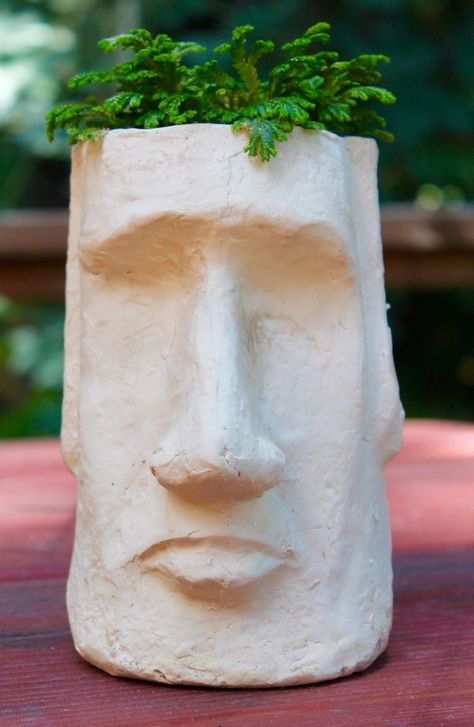 You don't have to journey to a far off island to experience exotic art. This Easter Island Head Planter brings it right to your tabletop. Easter Island Heads, Face Planters, Diy Ceramic, Head Planters, Unique Planter, Island Decor, Easter Island, Clay Art Projects, Ceramics Ideas Pottery