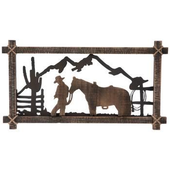 Celebrate your life out west with rustic accents like the Mountain Rancher Wood Wall Decor. This rectangular piece boasts a distressed black coating over a frame embellished with jute rope cross ties over each corner. There is a black metal mountain range, a tall cactus, and fence panels that host a spare hat and rope. In the center is the silhouette  of a cowboy guiding a horse. Display it up high for all to see as they visit the home you and your family have built from the ground up! Details: Western Paint Colors, Saddled Horse, Rope Cross, Tall Cactus, Western Wall Decor, Ranch House Decor, Western Bedroom Decor, Western Rooms, Horses Wall Decor