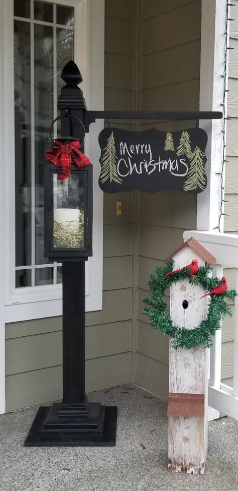 Porch Lamp Post, 4x4 Post Craft Ideas, Porch Candle Lanterns, Christmas Wood Hanging Signs, Diy Christmas Lantern Post, Lantern Post Diy, Porch Post Sign Holder, Christmas Sign Post, Diy Lamp Post Christmas