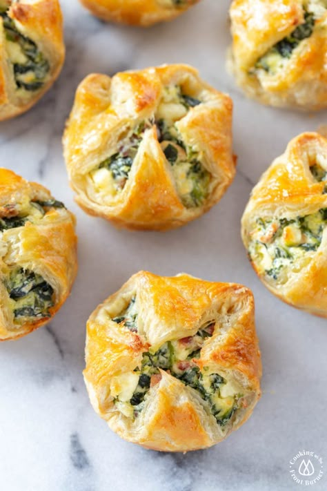 These Feta Spinach Bacon Puffs are the perfect party appetizer. A creamy filling with salty bacon and tangy feta is nestled in crispy, flaky puff pastry made easy in a muffin tin! #appetizer #puffpastryrn Puff Pastry Recipes Appetizers, Bacon Puffs, Spinach Puff Pastry, Spinach Puff, Ham And Cheese Pinwheels, Puff Pastry Appetizers, Pastry Appetizer, Hot Appetizers, Best Appetizer Recipes