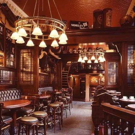 Alternatively, the interior of your pub may look like this: a little more glamorous, with touches like leather seating and pretty lighting. (Make sure your pub has a spare back room, or an upstairs area you can hire that's separate from the rest of the pub, and preferably doesn't contain the only bathroom in the place. This will save you tonnes of money compared to hiring out the whole place!) English Pub Interior, Irish Pub Interior, Pub Interior Design, Pub Interior, English Pub, Bar In Casa, Pub Design, Design Café, Home Pub