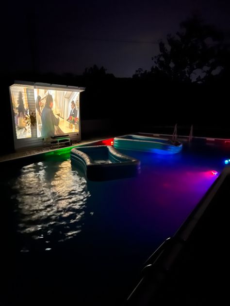 Loung in an inflatable kids pool with your blanket, pillow, etc. while floating in the pool and watching a movie. Outdoor Pool Movie Night, Floating Movie Night, Blow Up Pool In Pool Sleepover, Movie Night With Inflatable Pool, Movie Pool Night, Projector Pool Party, Pool Projector Ideas, Inflatable Pool Ideas Backyard Movie, Pool Projector Movie Night