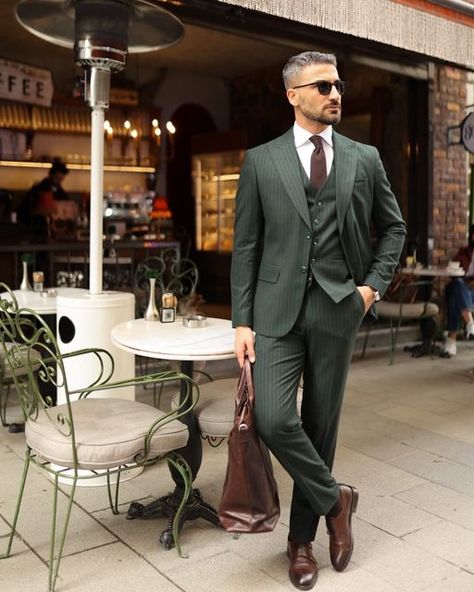 𝐌𝐑𝐆𝐔𝐈𝐋𝐃 on Instagram: "Canary Wharf ✨  Elevate your style with a tailored slim fit forest green three piece pinstripe men’s suit. The pinstripe pattern adds a touch of sophistication to the rich forest green hue, creating a harmonious blend of modern and classic. The peak lapels enhance its timeless appeal, making it ideal for formal events. This ensemble exudes confidence and refinement, allowing you to stand out with a distinctive and sophisticated look. Whether for upscale gatherings or special occasions, this suit showcases your impeccable taste and individuality.  #mrguild #sizebox #groom #wedding #menswear #mensfashion #fashion #menstyle #style #mensstyle #men #streetwear #fashionblogger #streetstyle #menfashion #instafashion #menwithstyle #mensclothing #instagood #model #mens Forest Green Suit Men, Men Wedding Suits Modern, Green Pinstripe Suit, Modern Suits Men, Men Green Suit, Three Piece Suit Mens, Wedding Menswear, Green Suit Men, Suit For Men Wedding