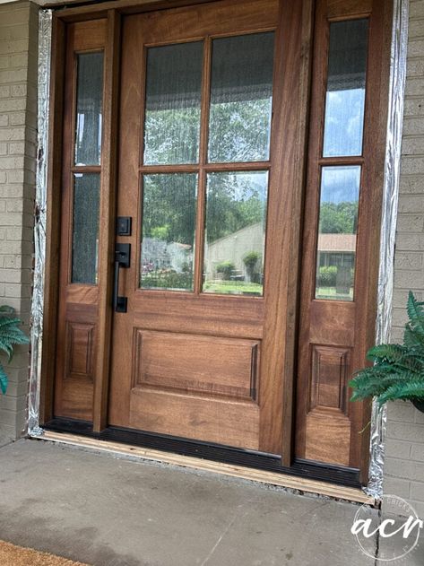 Wood Door Main Entrance, Wood Front Door With Side Panels, Mahogany Door Stained Light, Dark Grey House Wood Door, Interior Wood Front Door, Big Wood Front Door, Steel Front Doors That Look Like Wood, 3/4 Glass Door, Farmhouse Front Door Stain Colors