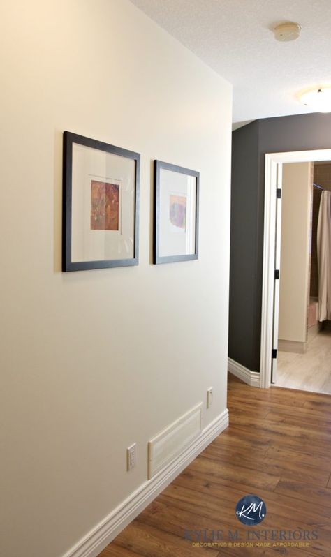 Sherwin Williams Creamy in a dark hallway with Benjamin Moore Gray Feature Wall or accent wall. Kylie M interiors. Laminate wood flooring and Cloud White trim Sw Creamy Walls, Off White Paint Colors For Walls, Gray Feature Wall, Sherwin Williams Creamy Walls, Hallway Paint Colors To Brighten, Sw Creamy, Grey Feature Wall, Sherwin Williams Creamy, Hallway Paint Colors