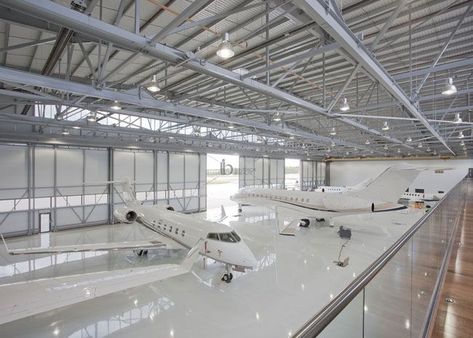 The steel space frame structure is suitable for the roof of the hangar. At present, the roof of the waiting hall, aircraft maintenance station and private hangar all use steel structure. On the one hand, it is convenient and flexible to install and disassemble, and on the other hand, it is low cost and long-lasting. Aircraft Hangar Design, Hangar Design, Private Jet Plane, Aircraft Hangar, Airplane Hangar, Luxury Jets, Luxury Private Jets, Private Aircraft, Airport Design