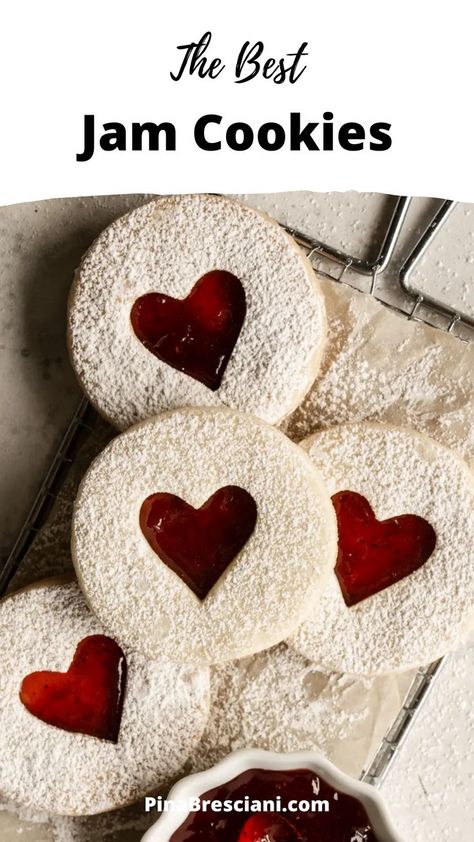 These strawberry jam cookies are made of a delectable shortbread dough, where delicious strawberry jam is sandwiched between two cookies. They store really well – so you can make them in advance, and serve them when the time is right! Also, how cute is the heart cutout? Strawberry Jam Cookies, Heart Cookies Recipe, Easy Jam, Linzer Cookies, Jam Cookies, Valentines Day Cookies, Valentine Cookies, Christmas Pudding, Homemade Cookies