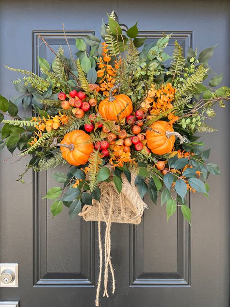 NEW Design for Fall - Fall Gatherings Basket with Burlap Wrap, Natural Twig Basket with Faux Autumn Arrangement Measurements: The basket wreath shown measures approximately 24" length x 24" width, tip to tip x 8" depth Materials: Features a natural twig basket with faux salal, orange eucalyptus, pumpkins and pods, burl Basket For Front Door, Twig Basket, Orange Eucalyptus, Front Door Baskets, Fruit Wreath, Wreath Hangers, Basket Wreath, Wreath Accessories, Fall Gathering